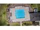 Aerial view of the community pool highlighting layout, design and ample lounge seating area at 15430 Long Cypress Dr, Ruskin, FL 33573
