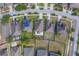 Overhead aerial view shows a home with a neat yard and a traditional roof in a quiet neighborhood at 15430 Long Cypress Dr, Ruskin, FL 33573