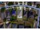 Aerial view of a home featuring a well-kept yard and a screened-in patio, surrounded by residential streets at 15430 Long Cypress Dr, Ruskin, FL 33573