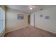 Inviting bedroom with plush carpet, neutral paint, ceiling fan, and stylish coastal decor at 15430 Long Cypress Dr, Ruskin, FL 33573