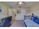 Inviting bedroom featuring a daybed, desk, and neutral walls, creating a comfortable and functional space at 15430 Long Cypress Dr, Ruskin, FL 33573