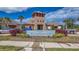 Community clubhouse featuring stone accents, a welcoming entrance, and beautifully landscaped surroundings at 15430 Long Cypress Dr, Ruskin, FL 33573