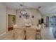 Inviting dining room with vaulted ceilings, pendant lighting, and access to the outdoor patio at 15430 Long Cypress Dr, Ruskin, FL 33573