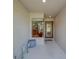 Inviting entryway with tiled floor, decor, and a large window providing bright natural light at 15430 Long Cypress Dr, Ruskin, FL 33573