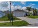 Inviting home with a spacious driveway and well-maintained lawn showcasing a desirable neighborhood aesthetic at 15430 Long Cypress Dr, Ruskin, FL 33573