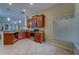 Bright kitchen with stainless steel appliances, granite countertops, and a view of the dining and living areas at 15430 Long Cypress Dr, Ruskin, FL 33573
