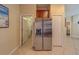 Contemporary kitchen with stainless steel refrigerator and ample storage cabinets at 15430 Long Cypress Dr, Ruskin, FL 33573