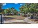 A grassy area offers benches, tables, and walking paths for residents to enjoy the outdoors at 15430 Long Cypress Dr, Ruskin, FL 33573