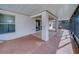 Enjoy outdoor living on this covered patio with plenty of space for relaxing or entertaining guests at 15430 Long Cypress Dr, Ruskin, FL 33573