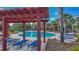 Resort style pool with plenty of seating and lounge chairs, perfect for relaxation and enjoying the outdoors at 15430 Long Cypress Dr, Ruskin, FL 33573