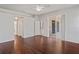 Bright bedroom with hardwood floors, ceiling fan, and sliding glass door leading to a patio at 16119 Bridgedale Dr, Lithia, FL 33547