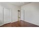 Bedroom featuring hardwood floors, double closets, and an entry to an outdoor space at 16119 Bridgedale Dr, Lithia, FL 33547