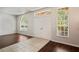 Bright foyer featuring tile and hardwood flooring with natural light from multiple windows at 16119 Bridgedale Dr, Lithia, FL 33547