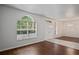 Bright foyer with large windows, tile entryway, and a chandelier with hardwood floors at 16119 Bridgedale Dr, Lithia, FL 33547