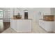 Open kitchen with white cabinetry, granite countertops, and stainless steel appliances at 16119 Bridgedale Dr, Lithia, FL 33547