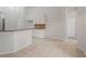 Spacious kitchen with white cabinets, tile flooring, granite counters and plenty of room at 16119 Bridgedale Dr, Lithia, FL 33547