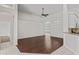 Open-concept living room with hardwood floors, vaulted ceilings, and plenty of natural light at 16119 Bridgedale Dr, Lithia, FL 33547
