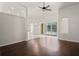 Bright living room with hardwood floors and sliding glass doors leading to the patio at 16119 Bridgedale Dr, Lithia, FL 33547