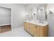 Elegant bathroom with double vanities, marble countertops, and modern fixtures at 16431 Penn State Rd, Weeki Wachee, FL 34614