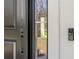 A welcoming front door with modern hardware and a Ring doorbell for added security at 16431 Penn State Rd, Weeki Wachee, FL 34614