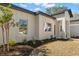 Close up shot of the front yard of a modern home with well placed garden beds at 16431 Penn State Rd, Weeki Wachee, FL 34614