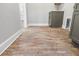 Laundry room with brick flooring offering ample space and access to the laundry facilities at 16431 Penn State Rd, Weeki Wachee, FL 34614