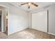 This bedroom features wood-style floors, a ceiling fan, and a closet with sliding doors at 1720 W Arch St, Tampa, FL 33607