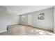 Bright and spacious living area featuring modern flooring, light gray walls, and natural light at 1720 W Arch St, Tampa, FL 33607