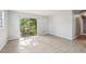 Bright, airy living room with modern flooring and a large sliding glass door to the outside at 1720 W Arch St, Tampa, FL 33607
