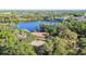 Overhead aerial view revealing the charming house and its serene lake setting at 201 Gornto Lake Rd, Brandon, FL 33510