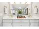 Elegant bathroom with double sink vanity, quartz countertop, and modern gold fixtures and hardware at 201 Gornto Lake Rd, Brandon, FL 33510