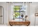 Bright bedroom featuring a wooden desk with drawers, offering a tranquil workspace with a view at 201 Gornto Lake Rd, Brandon, FL 33510