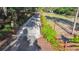 Long driveway surrounded by green hedges and mature trees leading to the property at 201 Gornto Lake Rd, Brandon, FL 33510