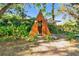 Exterior view of uniquely designed outbuilding with wood frame and natural landscaping, a tranquil backyard retreat at 201 Gornto Lake Rd, Brandon, FL 33510