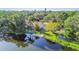 Breathtaking lakefront property with a lush yard, dock, and cozy seating area at 201 Gornto Lake Rd, Brandon, FL 33510