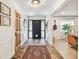 Inviting foyer with stone flooring, a decorative rug, and views into the living space at 201 Gornto Lake Rd, Brandon, FL 33510