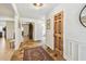 Bright foyer features stone floors, a wooden door, and an open layout into the home at 201 Gornto Lake Rd, Brandon, FL 33510