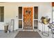 Close-up of an ornate wooden front door with sidelights and a decorative wreath at 201 Gornto Lake Rd, Brandon, FL 33510