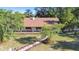 Inviting home with a covered porch and quaint rocking chairs, enhanced by a stone walkway at 201 Gornto Lake Rd, Brandon, FL 33510