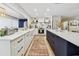 Well-designed kitchen with sleek white countertops, a center island, and modern appliances for efficient cooking at 201 Gornto Lake Rd, Brandon, FL 33510