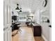 Well-lit home office setup with desk, monitor, and storage at 201 Gornto Lake Rd, Brandon, FL 33510