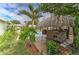Lush backyard with a tiki bar and a pool, perfect for outdoor gatherings in a private, tropical setting at 208 44Th Ne Ave, St Petersburg, FL 33703
