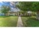 Inviting single-story home with a lush front yard, quaint front porch, and an inviting entrance at 208 44Th Ne Ave, St Petersburg, FL 33703