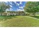 Well-kept single-story house boasts a green lawn, established trees, and a clean walkway at 208 44Th Ne Ave, St Petersburg, FL 33703