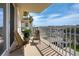 Relaxing balcony with chairs and plant, perfect for enjoying the view at 223 Island Way # 5D, Clearwater Beach, FL 33767