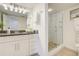 Modern bathroom with a glass-enclosed shower, granite countertops, and stylish fixtures at 223 Island Way # 5D, Clearwater Beach, FL 33767