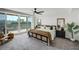 Well-decorated bedroom with balcony access, furniture, and ample natural light at 223 Island Way # 5D, Clearwater Beach, FL 33767