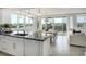 Stylish kitchen and dining area with granite countertops and stainless steel appliances at 223 Island Way # 5D, Clearwater Beach, FL 33767