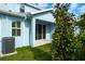 A cozy patio offers a serene view of the lush backyard with vibrant greenery at 2529 Mario Way, Clearwater, FL 33761
