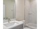 Bright bathroom featuring sleek, modern fixtures, marble tile and a clean, minimalist design at 2529 Mario Way, Clearwater, FL 33761